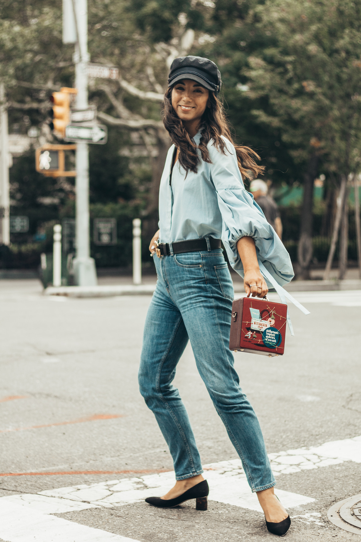 Who made Olivia Palermo's red bucket handbag, blue flared jeans, and beaded  pumps?